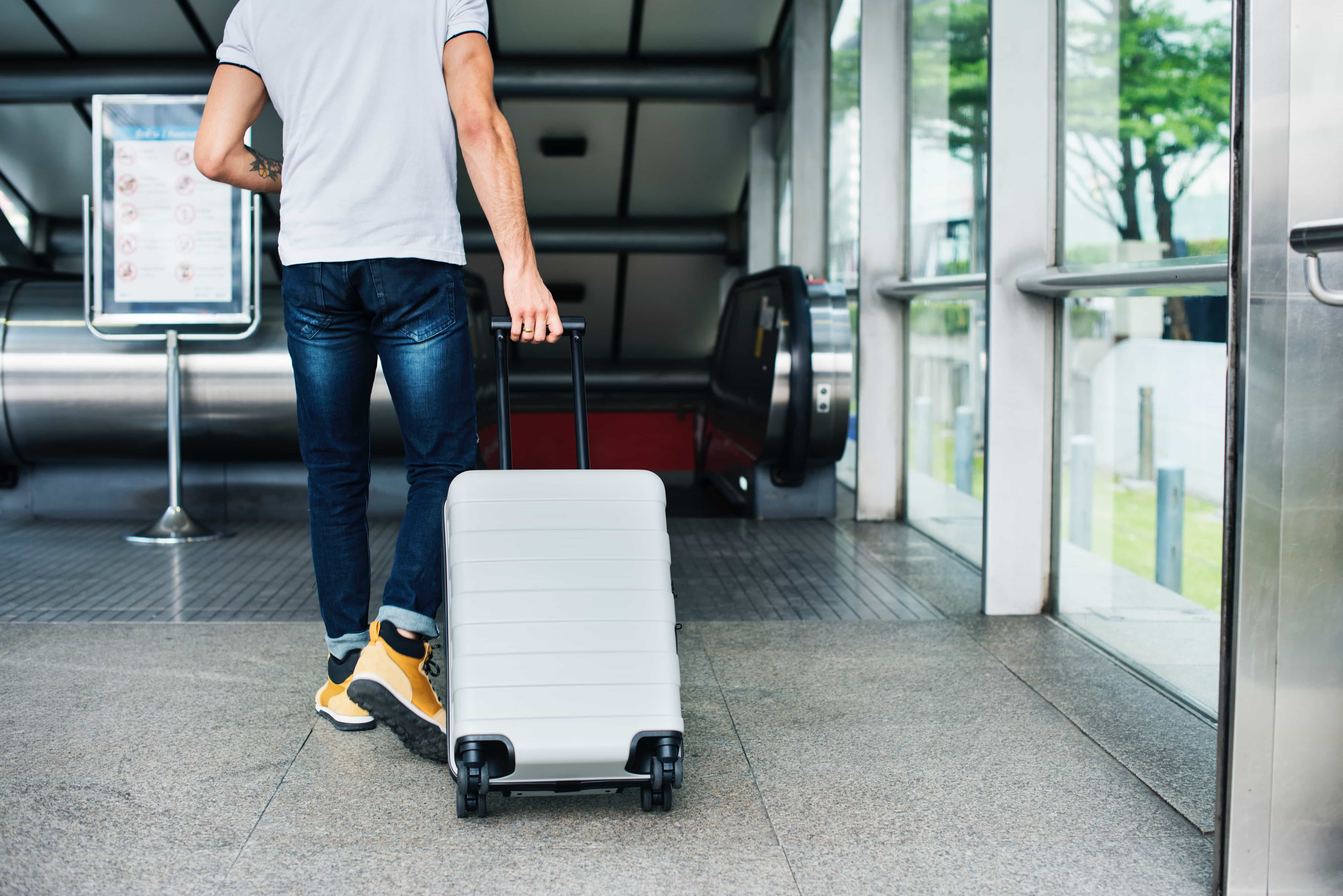 Man with suitcase at the airport