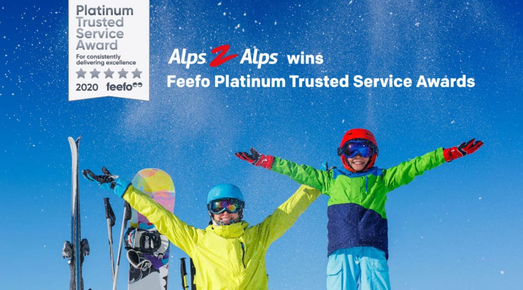 Happy skiers under a blue sky with text and Feefo award logo