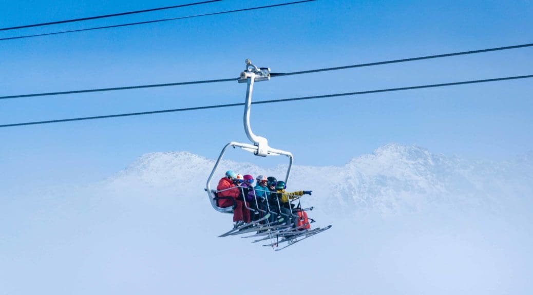 Skiers on ski lift